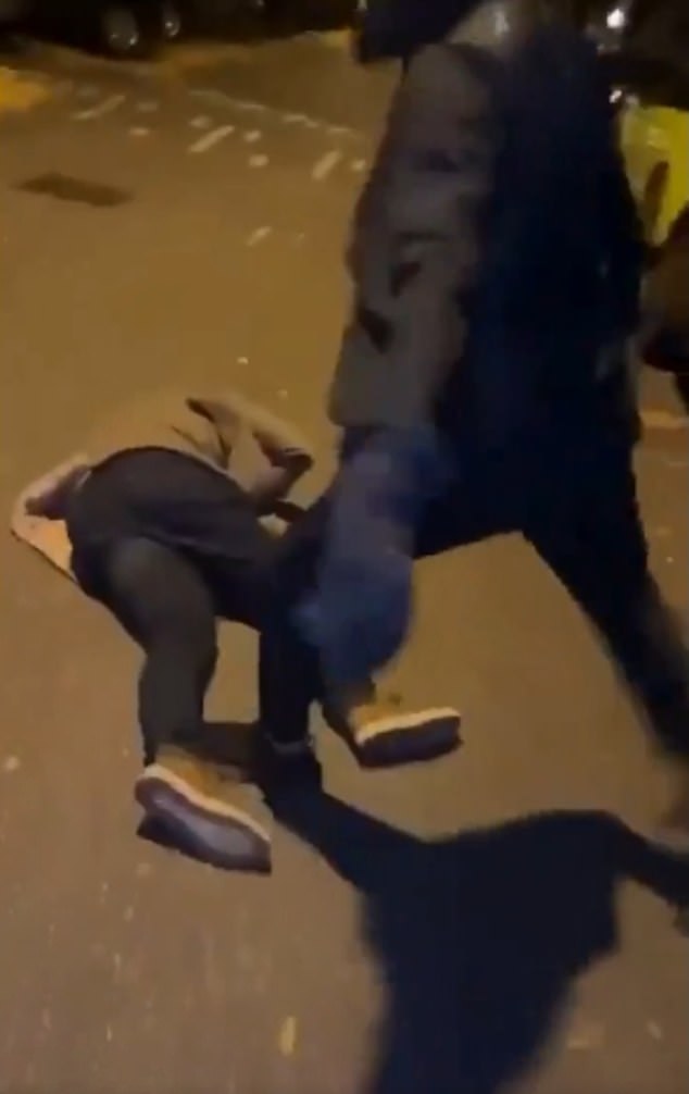 A particularly shocking clip appears to show a man being kicked by a group of thugs while lying on the ground