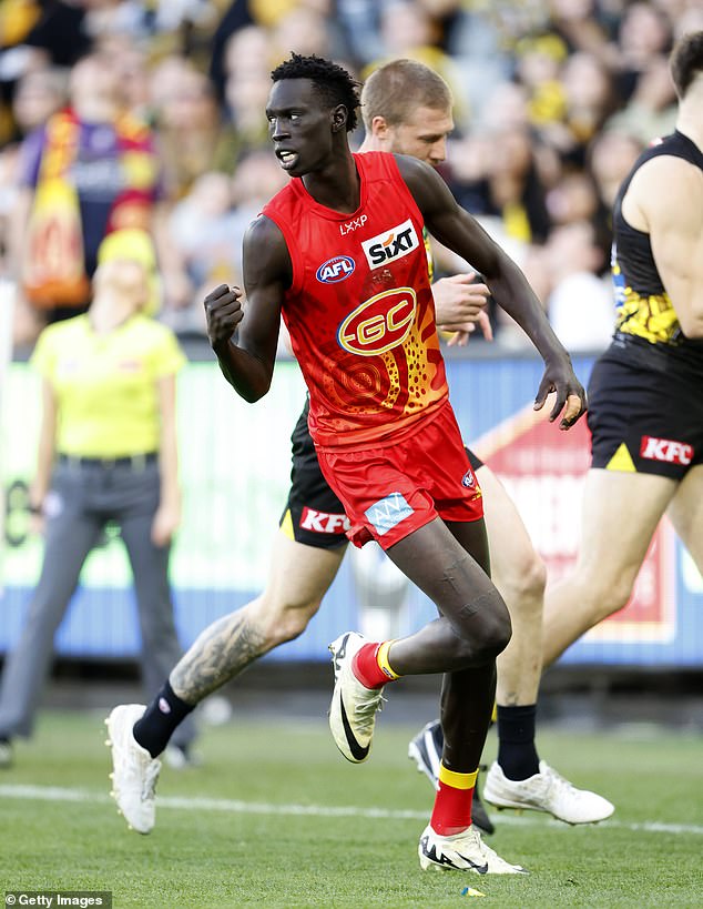 Gold Coast star Mac Andrew is pictured playing in the club's previous strip this season