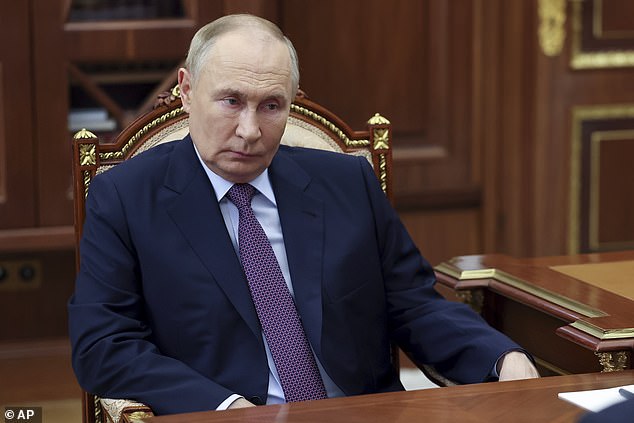 Vladimir Putin pictured at the Kremlin on November 12 during a meeting