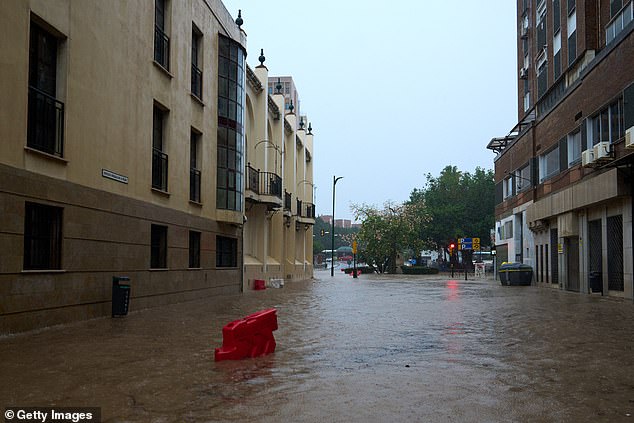 Streets have become submerged amid the heavy rains, with a red weather warning in place