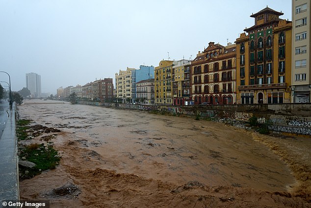 A general view of a canal near the Malaga city's historic centre as heavy rain hit the area