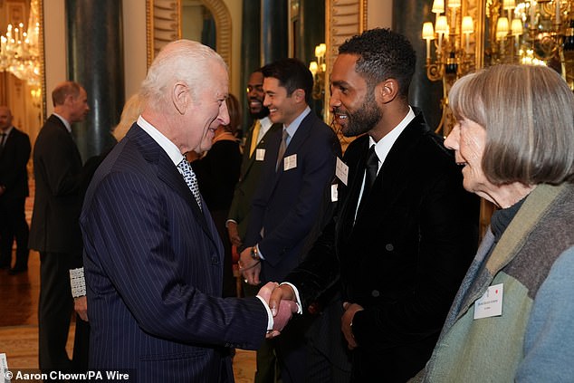 The royal looked to be in good spirits as he shook hands with the glamorous attendees at the reception