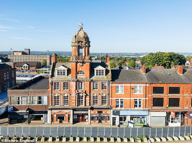 Wigan: Queens Hall Methodist Mission is the entrance block of a concert hall built in Edwardian Baroque style in 1906. The concert hall was demolished for a bus station but thankfully the entrance block remains