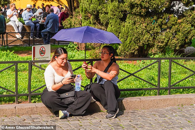 The average global temperature for last month was 59.58°F (15.32°C), according to the National Oceanic and Atmospheric Administration (NOAA). Pictured, people in Rome during a spell of humid weather, October 22, 2024