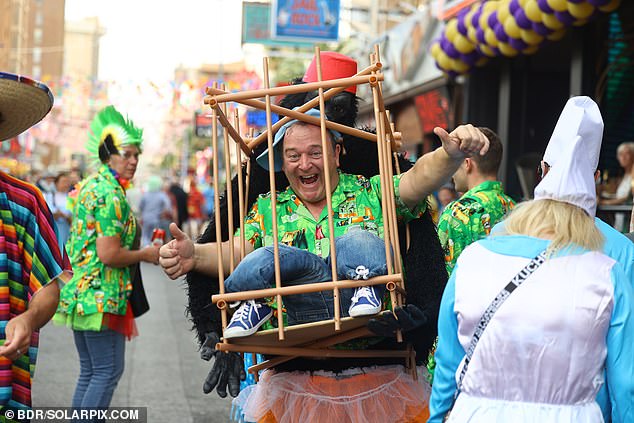 The lively parade has put charity in the spotlight with revellers collecting funds for those hit by Spain's devastating floods