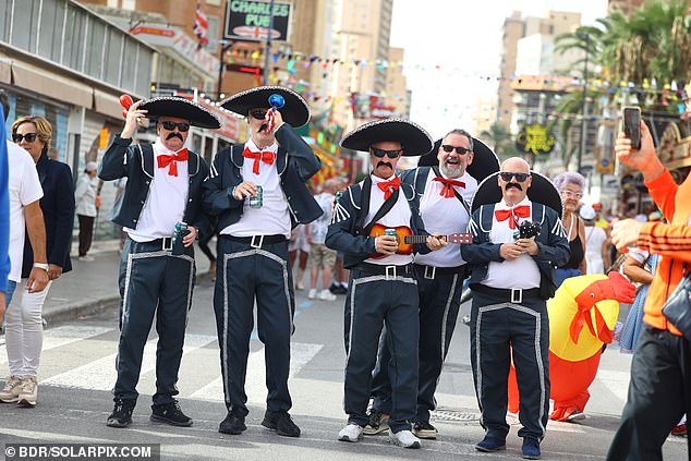 An inflatable chicken was seen mingling amongst a number of Spanish musicians