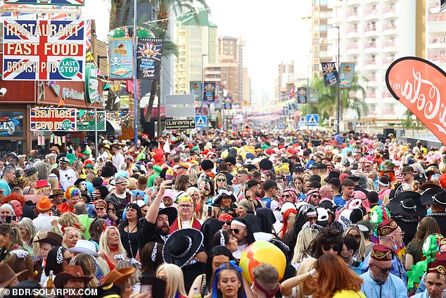 Crowds pour out onto the streets of Benidorm for the annual fancy dress party