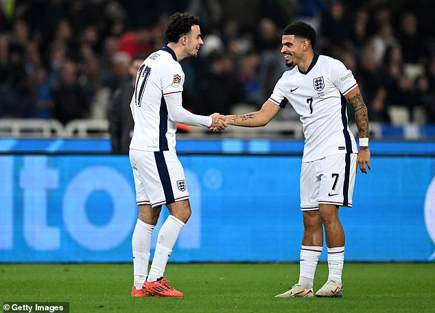 Curtis Jones (left) marked his debut with a brilliant goal - England's third - to cap an impressive night