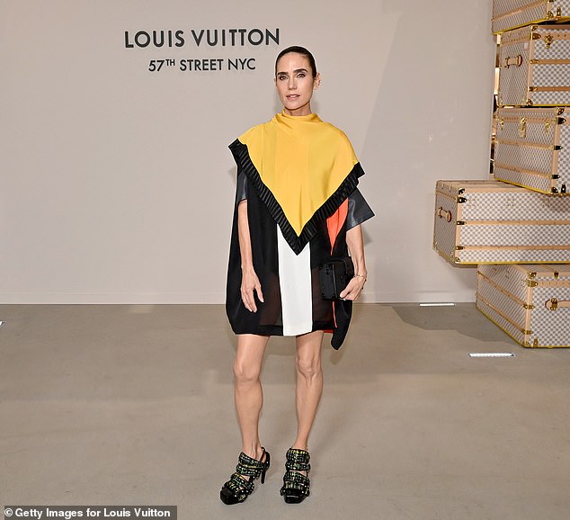 Connelly turned heads wearing a semi-sheer minidress that contained hues of black, white and orange. A yellow scarf detail was also added on the upper portion for a unique flare