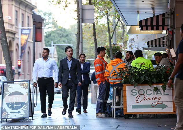 Aussie workers could soon be given two months of long service leave even if they don't remain with the same employer for 10 year under a radical new plan (pictured, workers in Sydney)