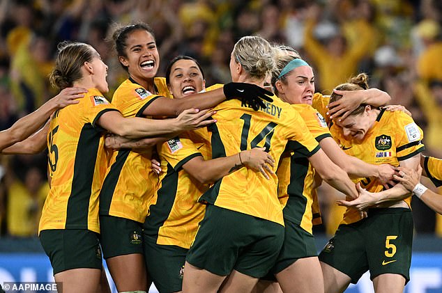 Vine, being mobbed by her Matildas teammates, will take an indefinite break from the sport