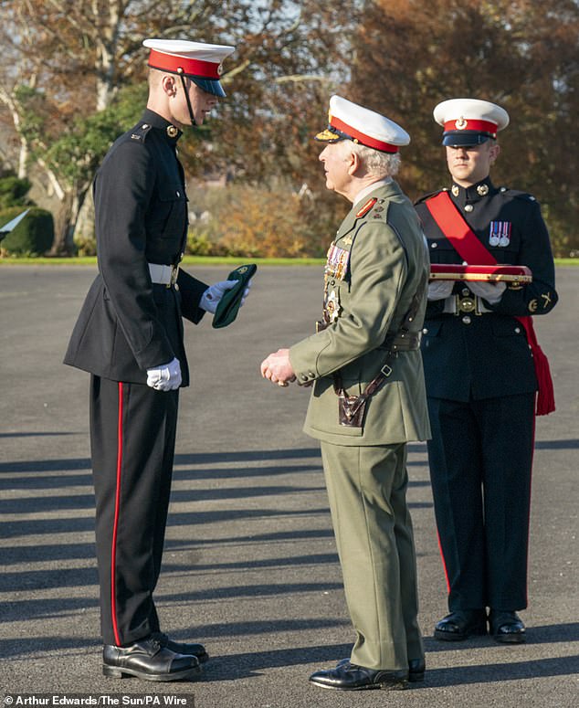 King Charles III, as Captain General Royal Marines, with Marine Joseph Ryan, who was awarded The Commando Medal