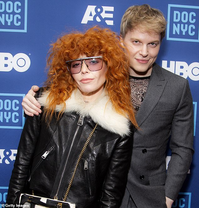 Natasha posed up with journalist and close friend Ronan Farrow