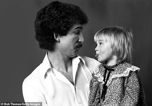 Liverpool's Graeme Souness with team-mate Kenny Dalglish's daughter Kelly in 1979