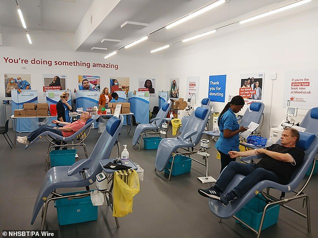 Blood donors giving an armful at an NHS clinic. Millions see blood donation as an old-fashioned middle-aged suburban practice, which is somehow no longer necessary