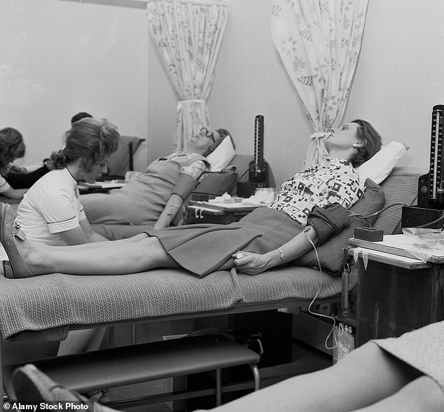 Blood donors being attended to by a female nurse at a health centre in Lewisham, south London in the late 60s/early 70s