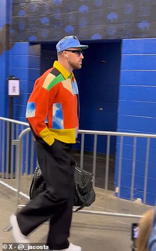 Kelce wore a multicolored jacket in a bold arrivals outfit