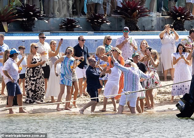 Anthony looked stylish in a striped shirt and white shorts as he danced with his new wife