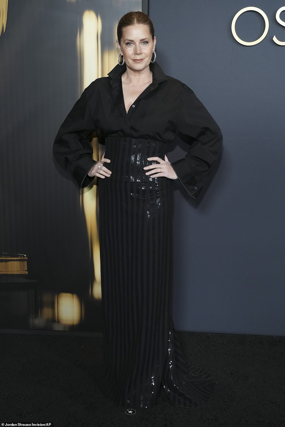 Amy Adams, 50, exuded elegance in an oversized black button-up tucked into a black sequin maxi skirt