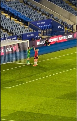 The pair even raised their arms to further block the stopper's view before the referee ushered them away