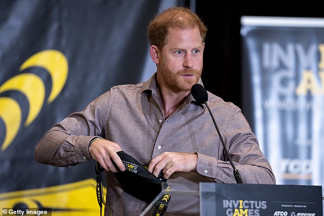 The duke opens an Invictus bag as he speaks at the official event