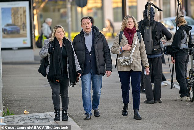 Gisele Pelicot's children Caroline Darian (R) and David (C) arrive at the courthouse today