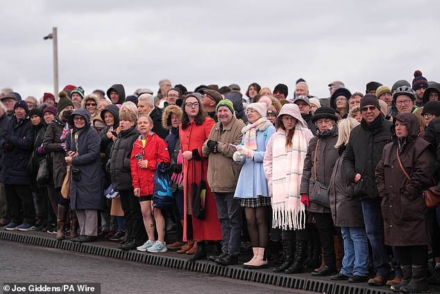 Crowds waited patiently as the Princess Royal was delayed by half an hour due to the weather