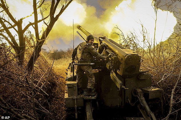 In this photo provided by Ukraine's 24th Mechanised Brigade press service, servicemen of the 24th Mechanised Brigade fire 2s5 self-propelled 152mm howitzer towards Russian positions near Chasiv Yar, Donetsk region, Ukraine, Monday, Nov. 18, 2024