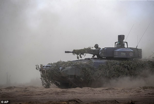 A German army Main battle tank Leopard 2A7V takes part in drills. According to a 1,000-page document entitled 'Operationsplan Deutschland', Germany would host hundreds of thousands of troops from NATO countries if the conflict to the East escalates