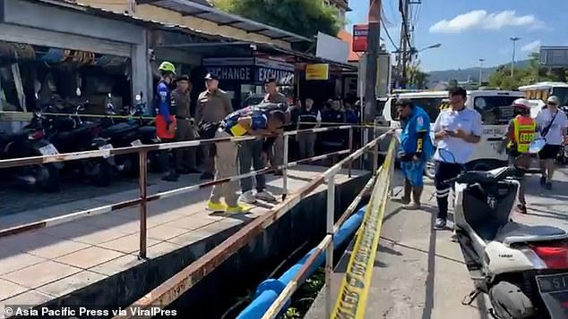 Shocked locals noticed the body this morning at around 9am floating face down in the shallow body of water