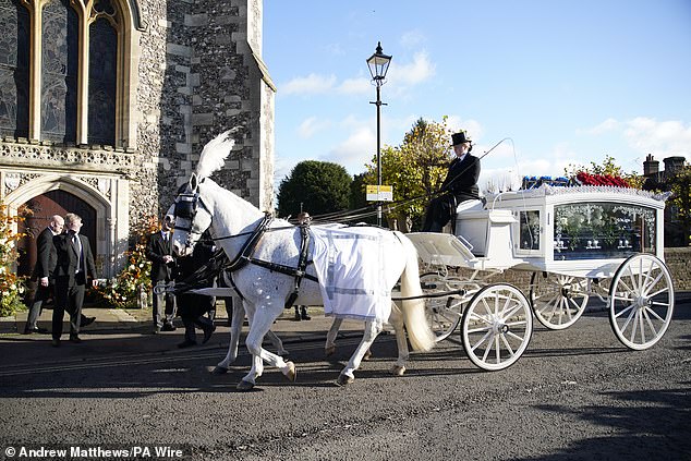 A horse-drawn carriage carrying the coffin of Liam Payne arrives for the funeral service of the One Direction singer at St Mary's Church in Amersham