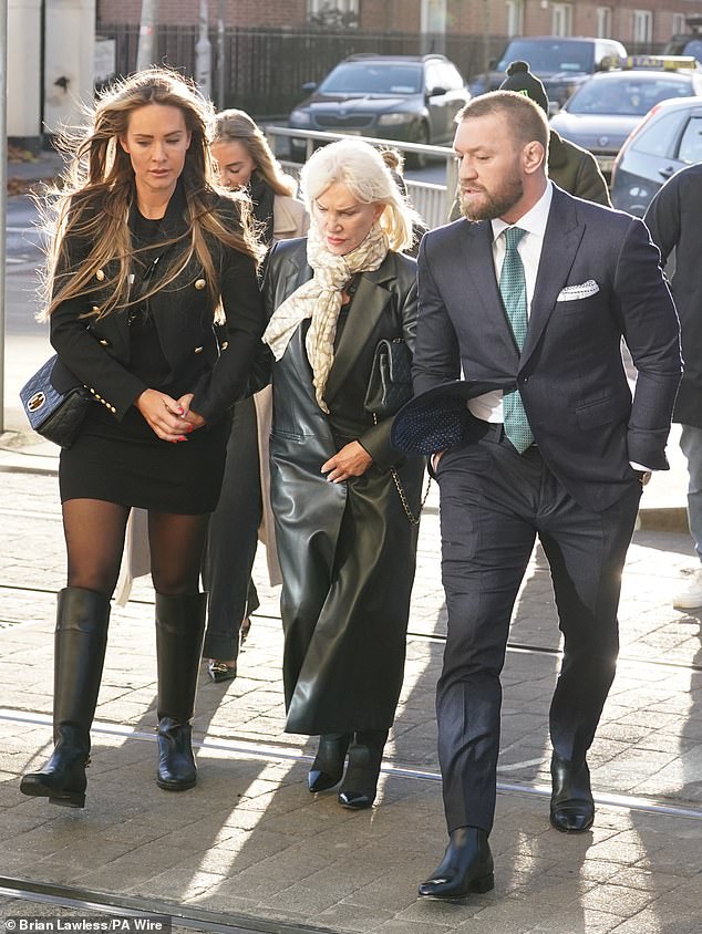 Conor McGregor, his mother Margaret and partner Dee Devlin outside the High Court in Dublin