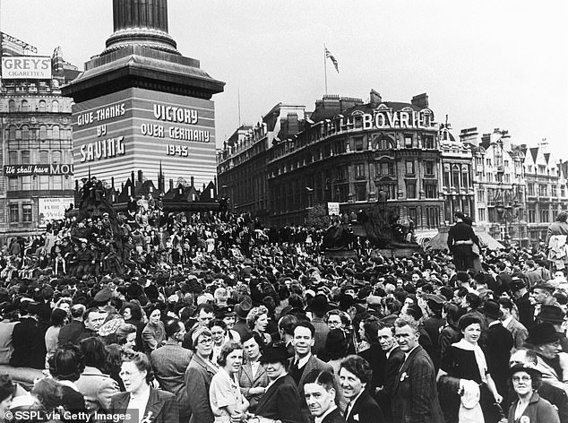 Pictured are celebrations in central London to mark VE Day in 1945 - when Nazi Germany surrendered, finally ending almost five years of war in Europe