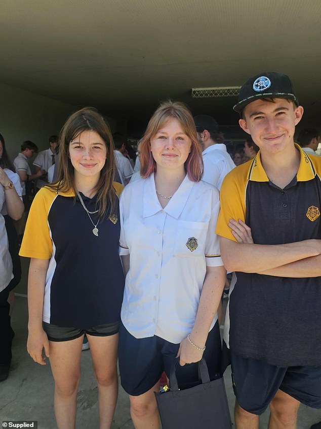 Beau is pictured alongside his sisters