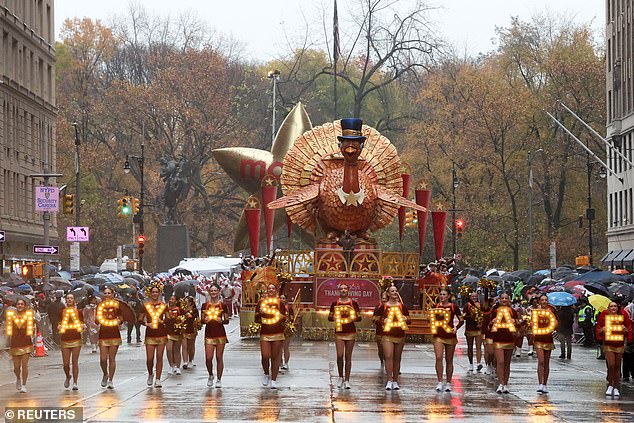 The Tom Turkey float rides during the 98th Macy's Thanksgiving Day Parade in the pouring rain