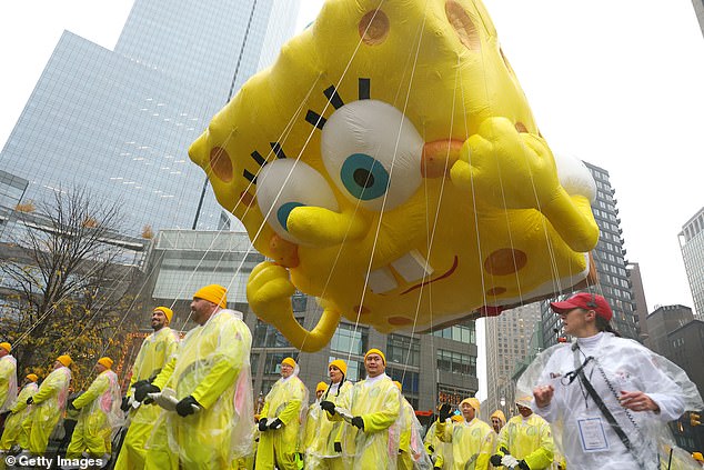 The rain isn't stopping anything as rain gear clad participants and audiences are braving the conditions to keep the parade going