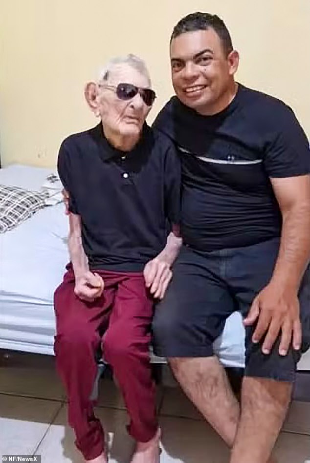 Joao pictured with his son. He became the world's oldest man after the death of Englishman John Alfred Tinniswood earlier this week