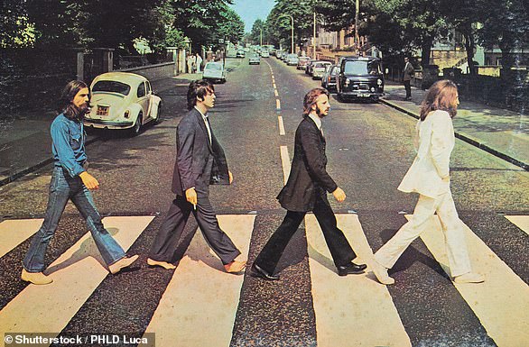 Iconic: The Abbey Road album features a photograph of the Beatles walking across the zebra crossing just outside the studio