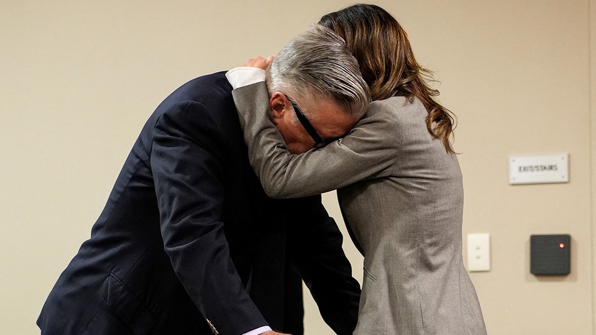 Hilaria Baldwin speaks to her husband Alec Baldwin during his trial