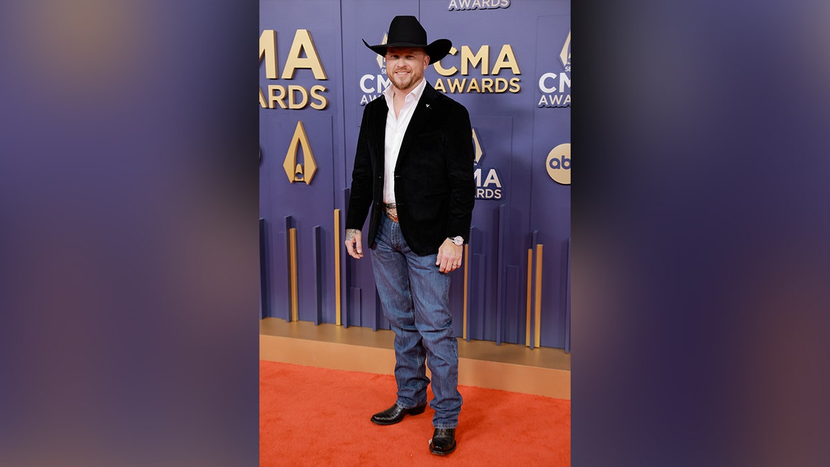 Cody Johnson wore jeans, a black jacket and a cowboy hat to the 2024 CMA Awards.