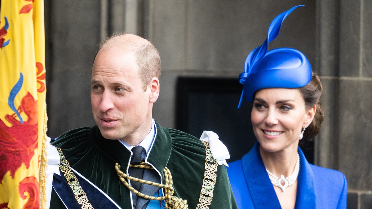 Prince William and Kate Middleton wearing traditional royal clothes and smiling