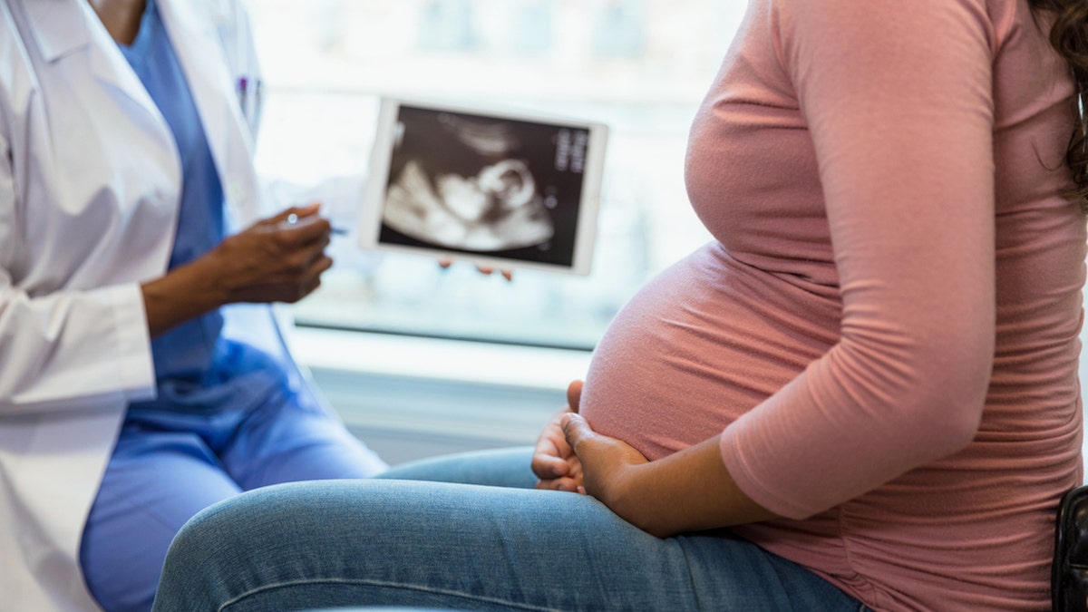 Pregnant woman at doctor