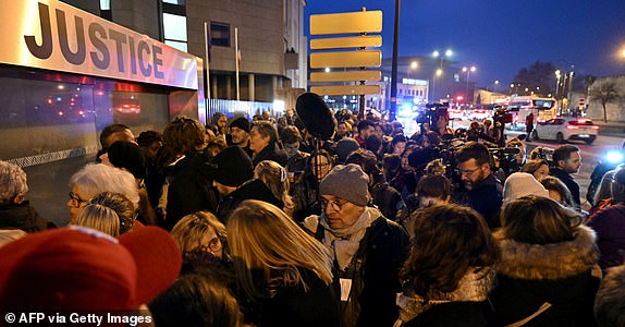 Journalists queue to enter the courthouse in Avignon on December 19, 2024, as the verdict is expected in the trial of a man, with 50 others, accused of drugging his wife and orchestrating multiple rapes over nearly a decade. A court in the French southern town of Avignon is trying Dominique Pelicot, a 71-year-old retiree, for repeatedly raping and enlisting dozens of strangers to rape his heavily sedated wife Gisele Pelicot in her own bed over a decade. Fifty other men, aged between 26 and 74, are also on trial for alleged involvement, in a case that has horrified France. (Photo by Miguel MEDINA / AFP) (Photo by MIGUEL MEDINA/AFP via Getty Images)