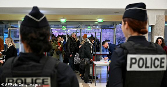 People enter the courthouse in Avignon on December 19, 2024, as the verdict is expected in the trial of a man, with 50 others, accused of drugging his wife and orchestrating multiple rapes over nearly a decade. A court in the French southern town of Avignon is trying Dominique Pelicot, a 71-year-old retiree, for repeatedly raping and enlisting dozens of strangers to rape his heavily sedated wife Gisele Pelicot in her own bed over a decade. Fifty other men, aged between 26 and 74, are also on trial for alleged involvement, in a case that has horrified France. (Photo by Miguel MEDINA / AFP) (Photo by MIGUEL MEDINA/AFP via Getty Images)