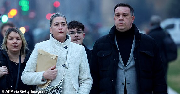 Caroline Darian (2nd L) and David Pelicot (R) arrive at the courthouse in Avignon on December 19, 2024, as the verdict is expected in the trial of their father, with 50 others, accused of drugging his wife and orchestrating multiple rapes over nearly a decade. A court in the French southern town of Avignon is trying Dominique Pelicot, a 71-year-old retiree, for repeatedly raping and enlisting dozens of strangers to rape his heavily sedated wife Gisele Pelicot in her own bed over a decade. Fifty other men, aged between 26 and 74, are also on trial for alleged involvement, in a case that has horrified France. (Photo by Clement MAHOUDEAU / AFP) (Photo by CLEMENT MAHOUDEAU/AFP via Getty Images)