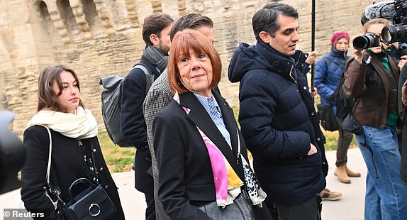 Frenchwoman Gisele Pelicot, the victim of an alleged mass rape orchestrated by her then-husband Dominique Pelicot at their home in the southern French town of Mazan, arrives with her lawyers Stephane Babonneau and Antoine Camus to attend the verdict in the trial for Dominique Pelicot and 50 co-accused, at the courthouse in Avignon, France, December 19, 2024. REUTERS/Alexandre Dimou