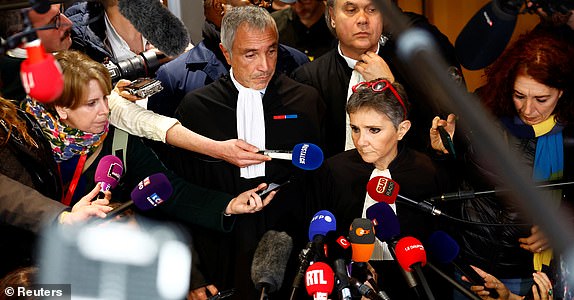 Beatrice Zavarro, the lawyer of Dominique Pelicot, a Frenchman accused of drugging his then-wife Gisele Pelicot and recruiting dozens of strangers to rape her at their home in the southern French town of Mazan, talks to journalists after the verdict in the trial for Dominique Pelicot and 50 co-accused, at the courthouse in Avignon, France, December 19, 2024. REUTERS/Manon Cruz