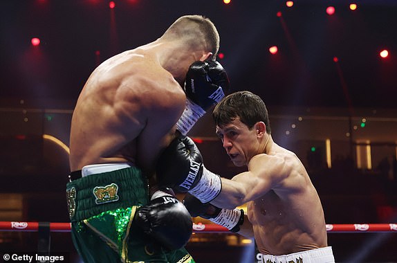 RIYADH, SAUDI ARABIA - DECEMBER 21: Peter McGrail punches Rhys Edwards during the Featherweight fight between Peter McGrail and Rhys Edwards as part of Oleksandr Usyk v Tyson Fury 2, Reignited card at Kingdom Arena on December 21, 2024 in Riyadh, Saudi Arabia. (Photo by Richard Pelham/Getty Images)