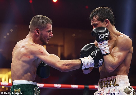 RIYADH, SAUDI ARABIA - DECEMBER 21: Rhys Edwards punches Peter McGrail during the Featherweight fight between Peter McGrail and Rhys Edwards as part of Oleksandr Usyk v Tyson Fury 2, Reignited card at Kingdom Arena on December 21, 2024 in Riyadh, Saudi Arabia. (Photo by Richard Pelham/Getty Images)