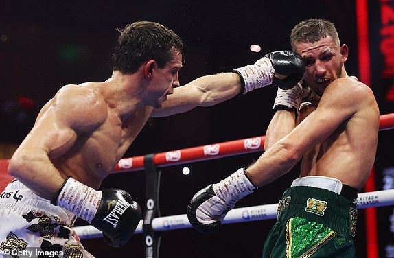 RIYADH, SAUDI ARABIA - DECEMBER 21: Peter McGrail punches Rhys Edwards during the Featherweight fight between Peter McGrail and Rhys Edwards as part of Oleksandr Usyk v Tyson Fury 2, Reignited card at Kingdom Arena on December 21, 2024 in Riyadh, Saudi Arabia. (Photo by Richard Pelham/Getty Images)